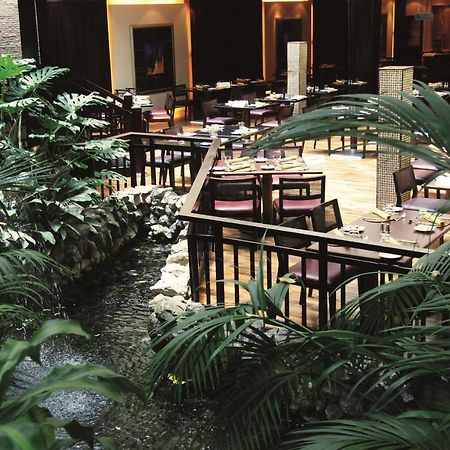Radisson Blu Resort, Sharjah Restaurant photo The interior of the hotel