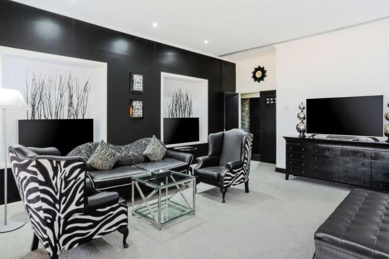 Radisson Blu Resort, Sharjah Exterior photo A living room with zebra print furniture