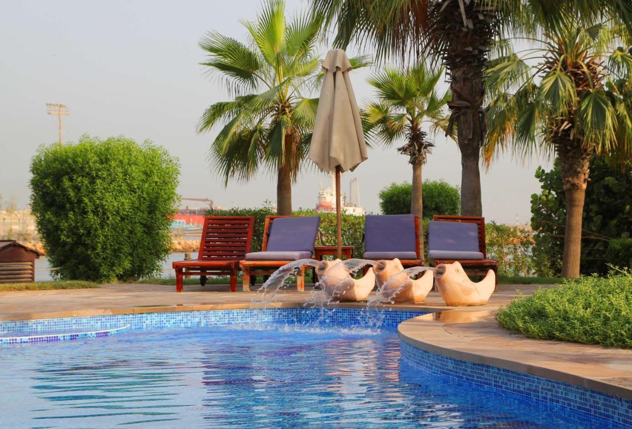 Radisson Blu Resort, Sharjah Exterior photo The pool at the hotel